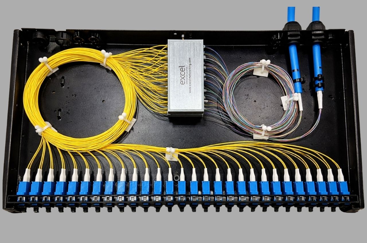 Fibre optic patch panel with neatly organised colour-coded fibre cables installed by Supernet Communications in a commercial network cabinet